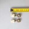 Brass White Flower Bloom Crystal Clip Dangling Earrings